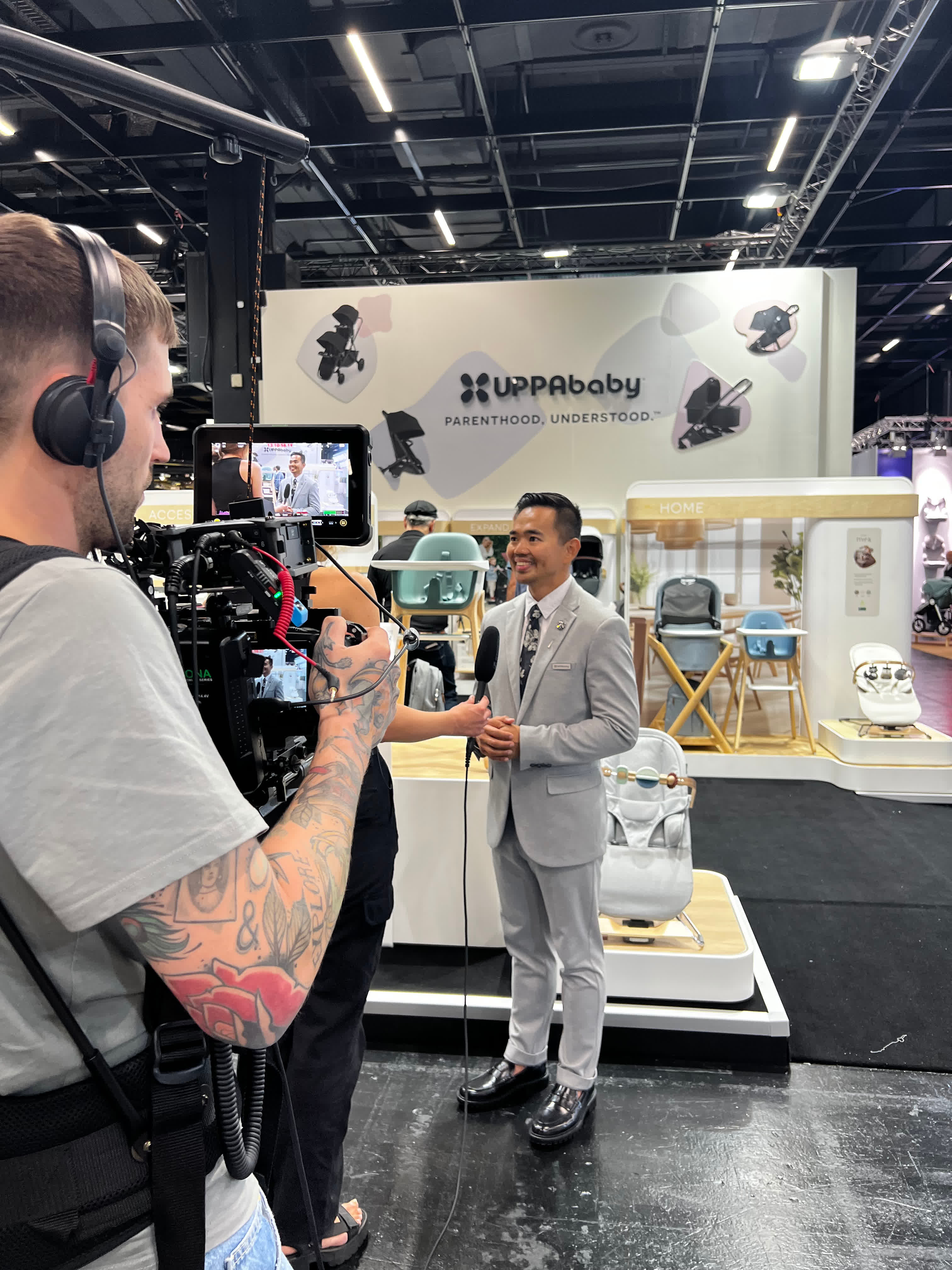 Joseph Alcantara being interviewed on camera at UPPAbaby