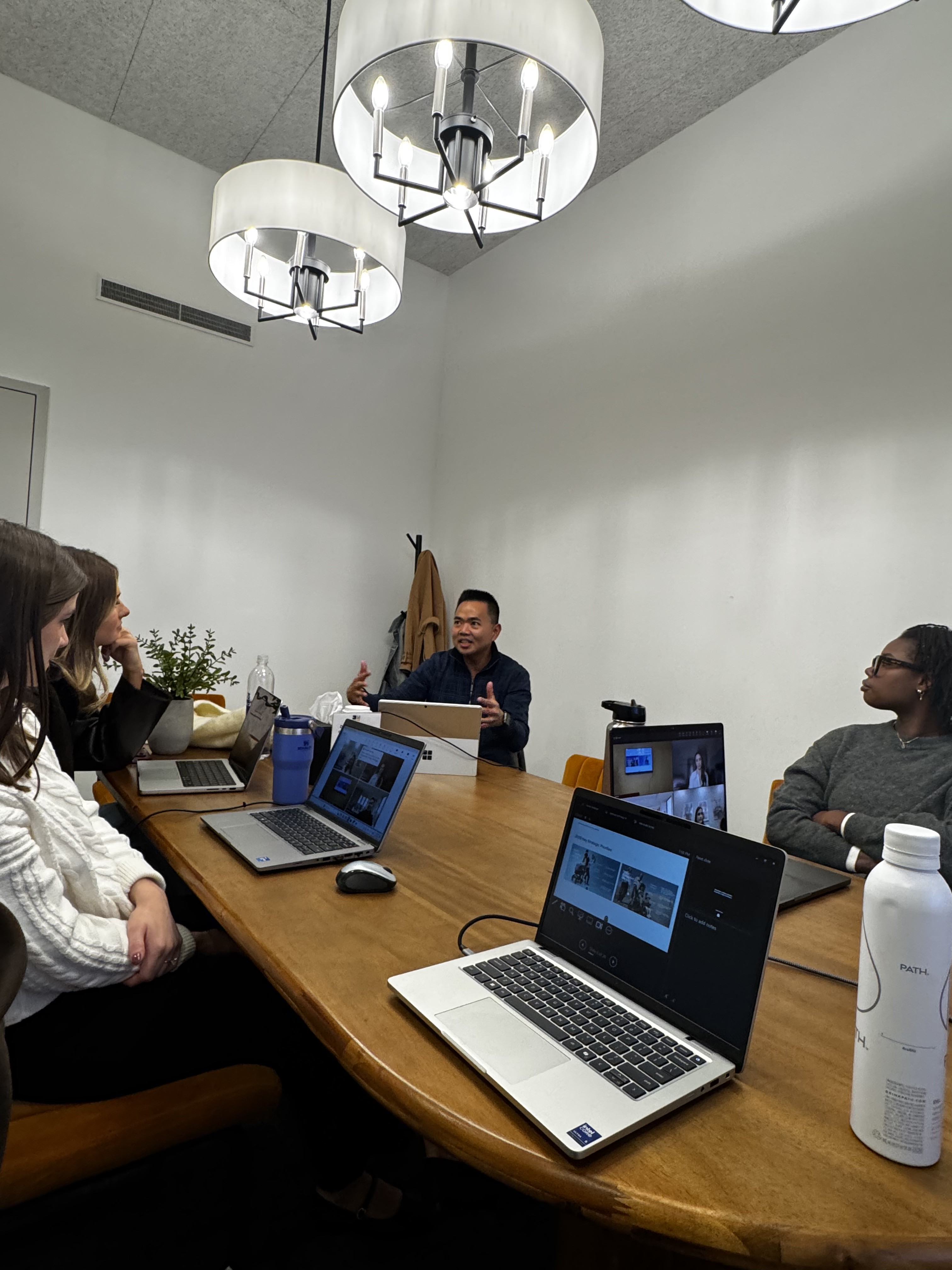 Joseph Alcantara leading a planning workshop around a conference table